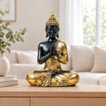 Buddha Thailanda oro e nero in preghiera